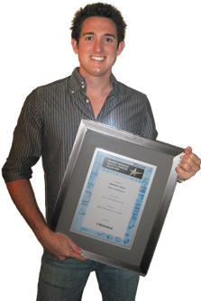 Picture of Damien Viero holding QLD Media Award